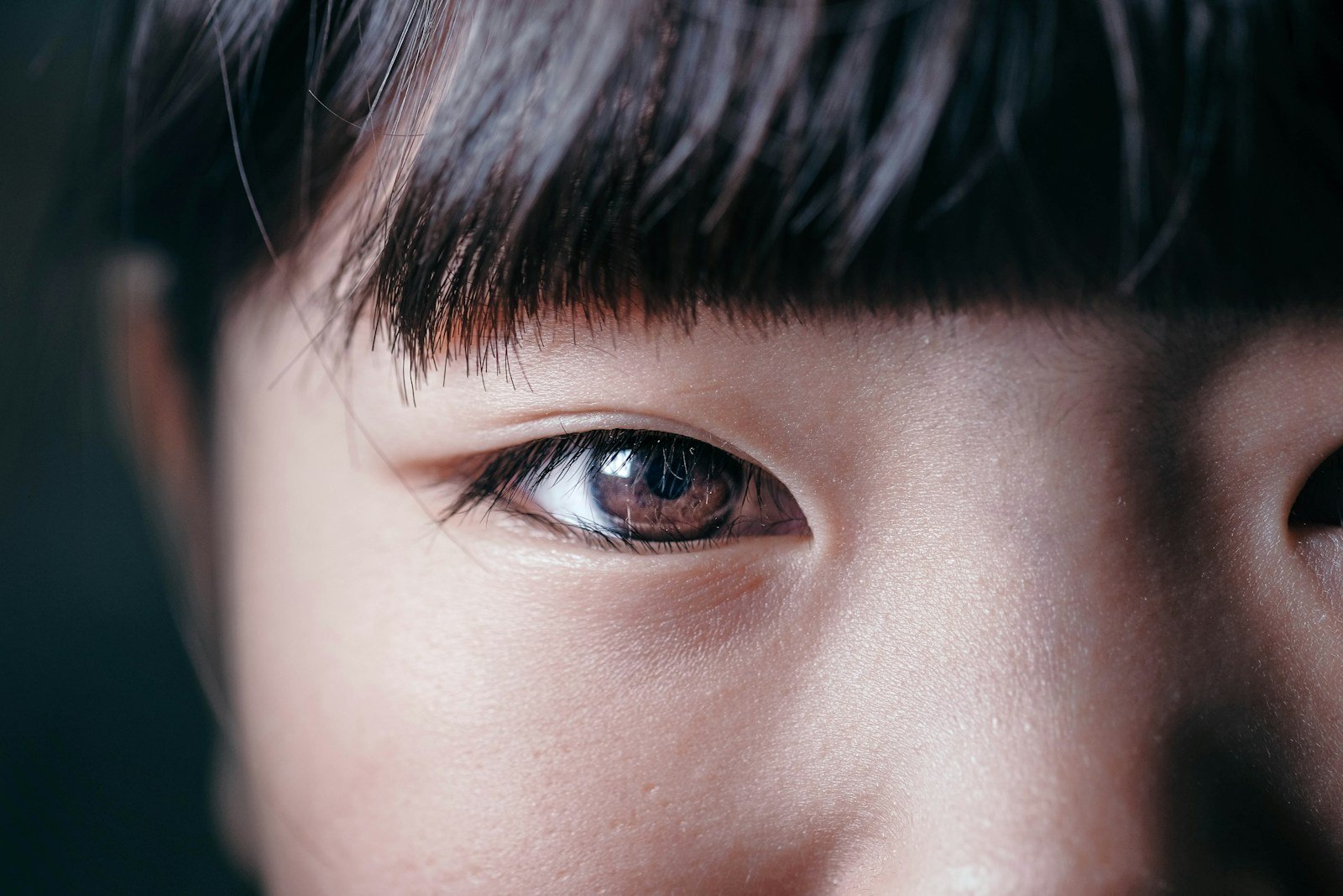 A close-up of an eye stares directly at the viewer.